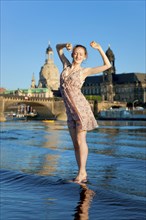 Young woman on the Elbe meadows in Dresden