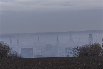 View from Dresden's Südhöhe of the city centre with its towers sinking into the fog