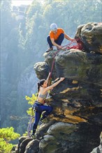 Climbers in Rathen in Saxon Switzerland