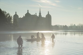 Fishing of the castle pond in Moritzburg