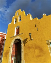 Yellow facade frontage of historic church convent of San Roque, Campeche city, Campeche State,