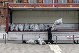 Young people collecting and loading plastic empties, Special Olympics, Berlin, Germany, Europe