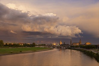 Silhouette of the Old Town of Dresden on the Elbe with storm clouds