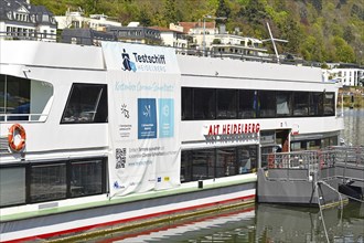 Heidelberg, Germany, April 2021: Corona virus test station called 'Testschiff' on boat offering