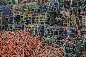 Lobster cages, lobster pots, here in Portugal, Algarve, Stacked fishing nets and ropes in different