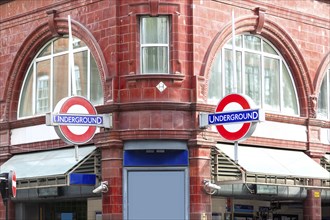 Entrance to a London Underground station with red brick building, London, United Kingdom United