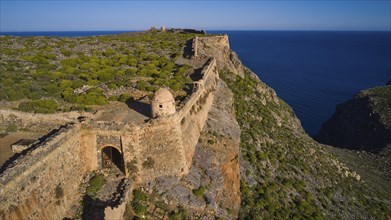 Drone shot, Part of a historic fortress on a cliff overlooking the Blue Clipper, Venetian sea