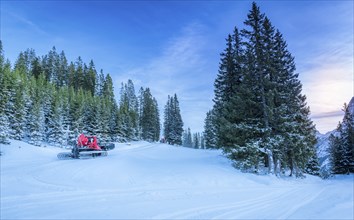 Winter scenery with lots of snow over the forestry roads in the Austrian Alps mountains and two