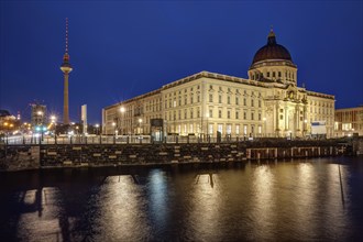 The rebuilt city palace and the television tower in Berlin by night