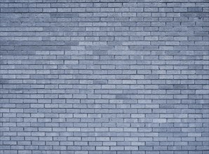 A full frame blue toned textured brick wall background