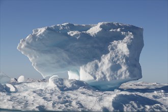 Iceberg in Nunavut with sunshine (canadian arctic sea)