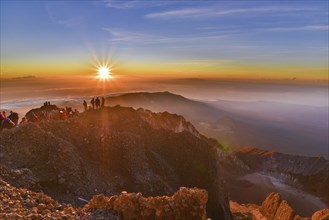 People on the summit of volcano Rinjani watching sunrise, Lombok, Indonesia, Asia