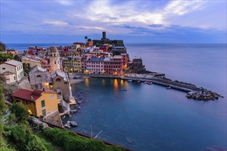 Sunset view of Vernazza, one of the five Mediterranean villages in Cinque Terre, Italy, famous for