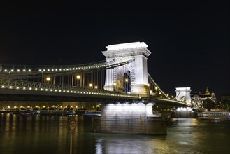 Night view of Széchenyi Chain Bridge across the River Danube connecting Buda and Pest, Budapest,