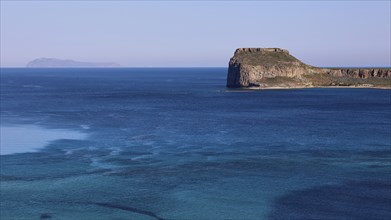 View of a small island with cliffs in the blue sea, Venetian Sea Fortress, Gramvoussa, Gramvoussa