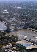 Aerial view of Tower Bridge and surrounding city buildings on a clear day, London, England, United