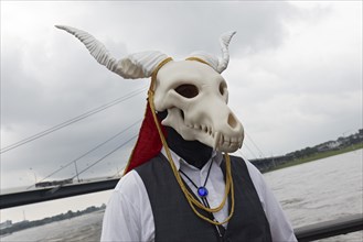 Costumed man wears scary mask, skull with screw horns, cosplay at Japantag Düsseldorf, Düsseldorf,