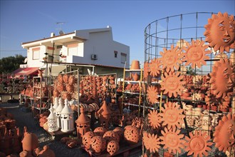 Pottery at Cacela Vehla, Algarve, Portugal, An outdoor area of a shop with lots of terracotta