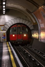 The red underground railway runs through a London Underground tunnel, London, United Kingdom United