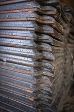 Many roof tiles stacked in barn, cobwebs, close-up, Wallonia, Belgium, Europe