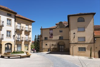 Sunny day in an old town with historic buildings, cobblestones and red roofs, Iglesia del Carmen,