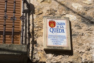 Close-up of a stone sign with Spanish text on a wall, alley of the Queda, Sepúlveda, Sepulveda,