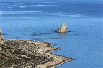 Rocky island in the calm blue sea, peaceful and quiet coastal landscape, Gramvoussa, Gramvoussa