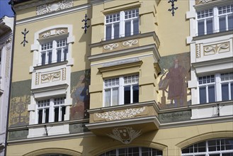 Historic building with elaborate façade paintings and decorative stucco elements, Leonhaus,