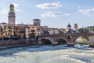 View of Verona historical city centre, Ponte Pietra bridge across Adige river, Verona Cathedral,