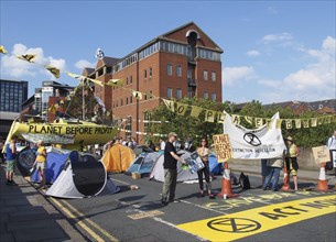 Leeds, west yorkshire, united kingdom, 16 july 2019: extinction rebellion protesters blocking thee