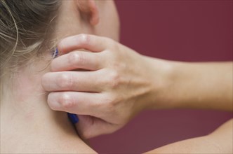 Great concept of allergy and skin diseases, young woman scratching herself