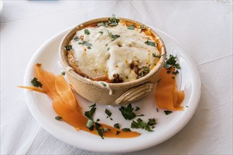 Veal ramequin au gratin with feta cheese with Greek pasta