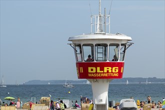 Summer weather, bathers, beach chairs and DLRG lifeguard tower on the beach, Travemünde beach,