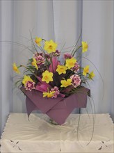 Flower arrangement on plain background