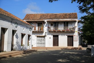 Beautiful old white buildings in sunlight, trees in shadow, Santa Cruz de Mompox, Colombia, World