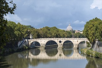 River Tiber and sisto bridge with St Peters in the distance Rome