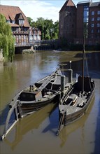 Historical Boats on the River Ilmenau in the Old Town of Lüneburg, Lower Saxony, Germany, Europe