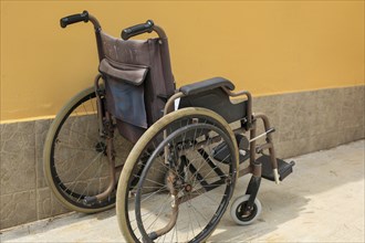 Bunch of empty wheelchairs parked in hospital