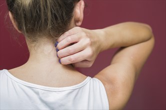 Great concept of allergy and skin diseases, young woman scratching herself