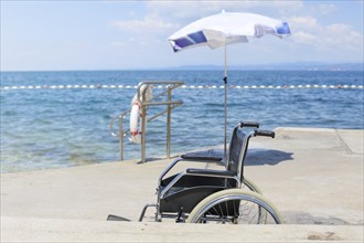 Wheelchair on an accessible beach for transportation of people with disabilities in the water