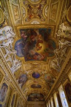 Decorated ceiling of the Apollo Gallery (Galerie d'Apollon) at Louvre Museum in Paris, France,