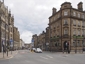 Huddersfield, west yorkshire, United Kingdom, 20 May 2019: traffic and pedestrians on the road