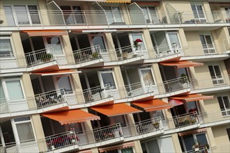 Façade with balconies and awnings of the Rosenhof retirement home on Priwall, Travemünde seaside