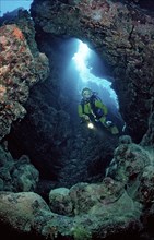 Diver in underwater cave, Egypt, Zabargad, Zabarghad, Red Sea, Africa