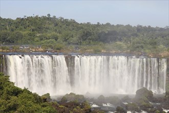 Iguassu waterfalls on a sunny day early in the morning. The biggest waterfalls on earth