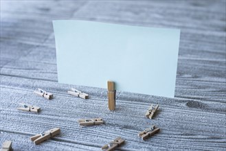 Piece Of Blank Square Note Surrounded By Laundry Clips Showing New Idea