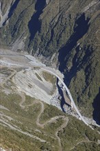 Otira Viaduct at Arthur's Pass, West Coast, South Island, New Zealand. Old road winds up the hill