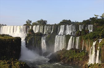 Iguassu waterfalls on a sunny day early in the morning. The biggest waterfalls on earth