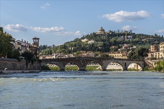 View of Verona historical city centre, Ponte Pietra bridge across Adige river, Verona Cathedral,