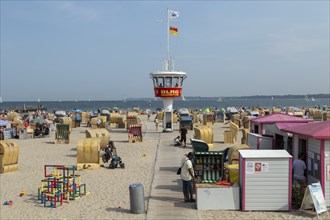 Summer weather, bathers, beach chairs and DLRG lifeguard tower on the beach, Travemünde beach,